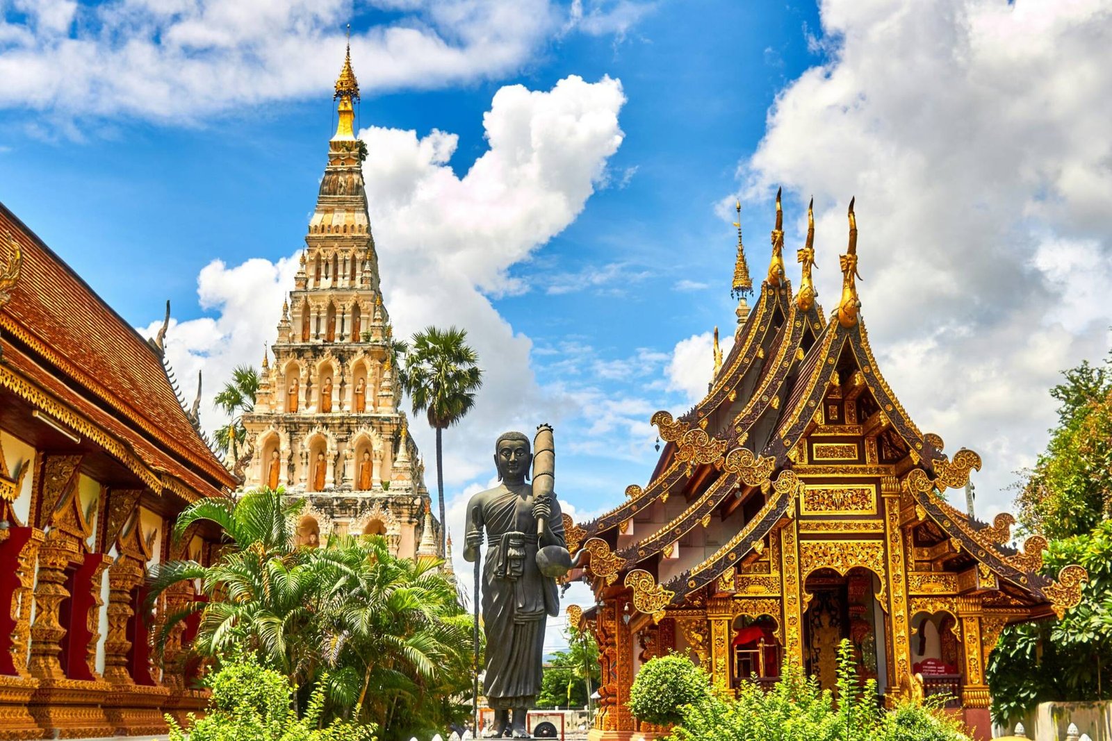 Golden spires of Wat Arun temple on the Chao Phraya River, a top Thailand tourist attraction in Bangkok