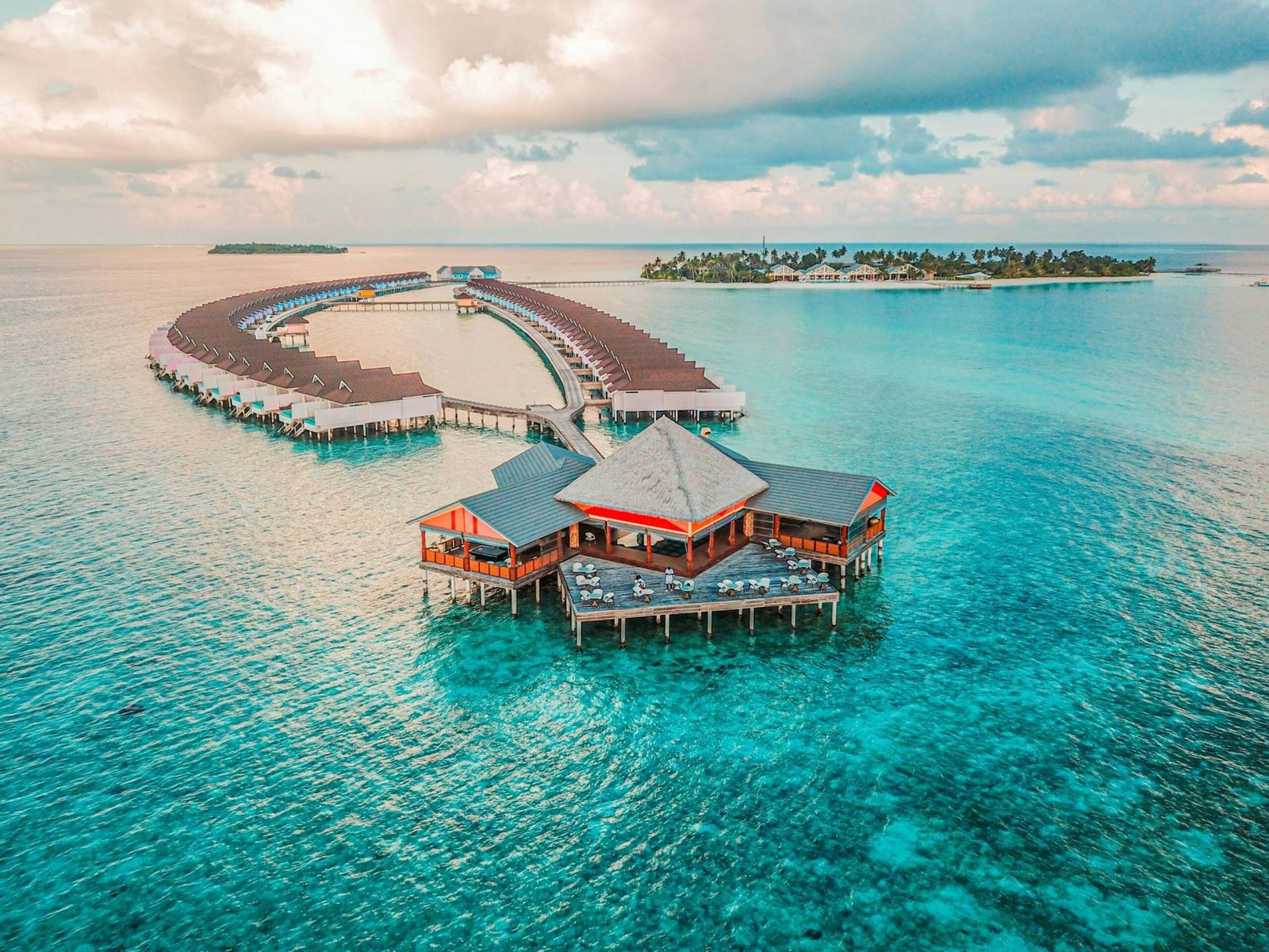 Luxury overwater bungalows at a Maldives premium resort with turquoise ocean access.