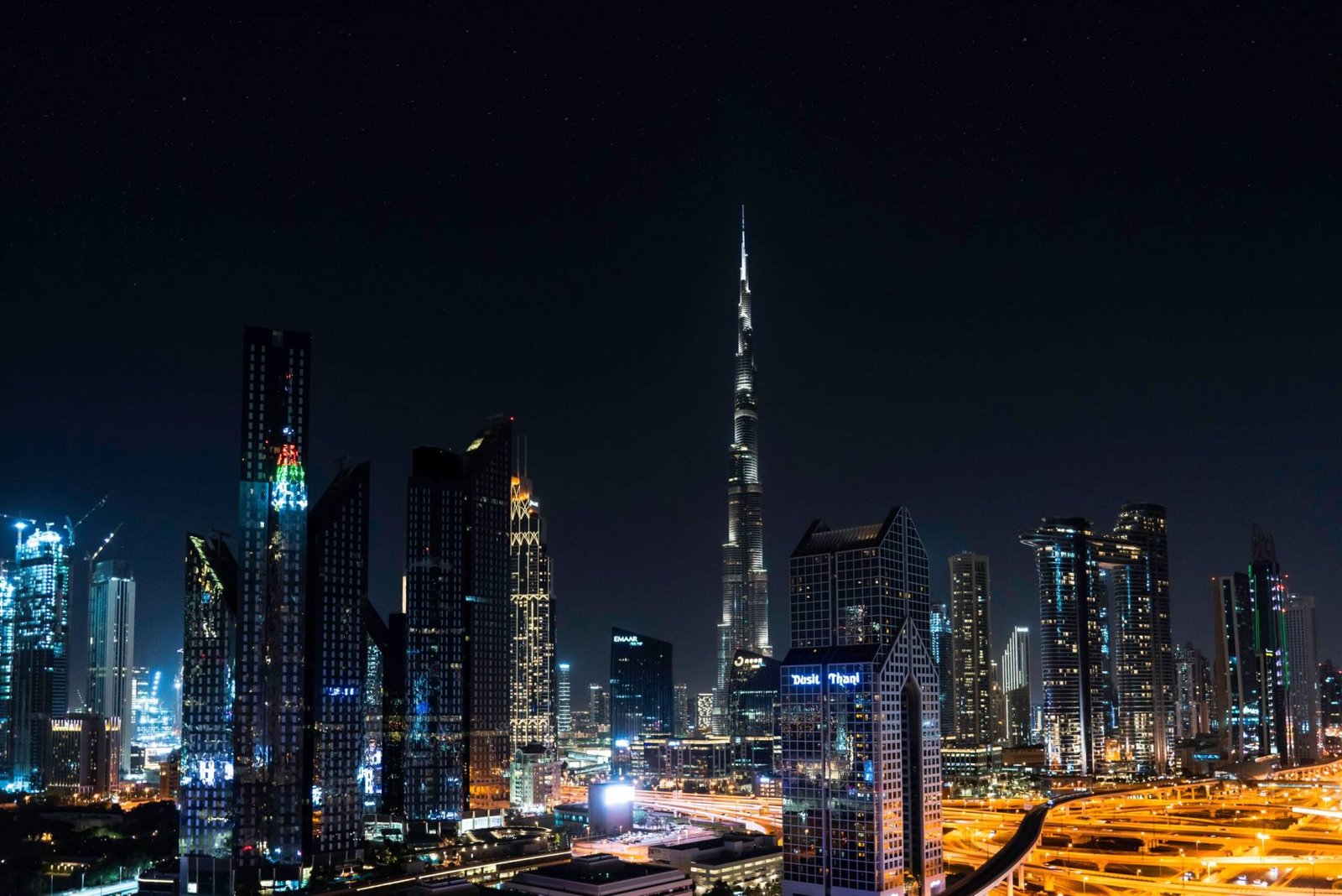 Burj Khalifa skyscraper towering over Downtown Dubai fountain, an iconic Dubai tourist attraction.